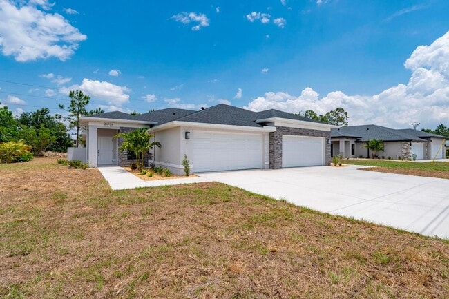 Photo - NEW Villa-duplex home with quartz counters, 2-car garage, and a rear patio