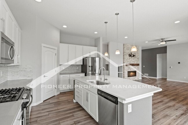 Photo - Elegant Ranch-Style Home with Main Floor Primary Bedroom with 3-Car Garage and Finished Basement ...