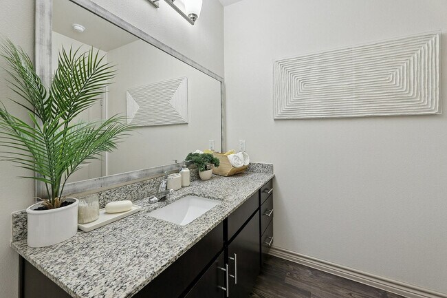 Spacious bathroom with large mirror and lots of counter space