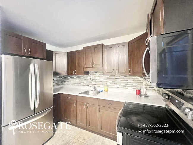 Photo - Pet-Friendly 3-Bedroom Stacked Townhome with Garage & Backyard in London Unit 21