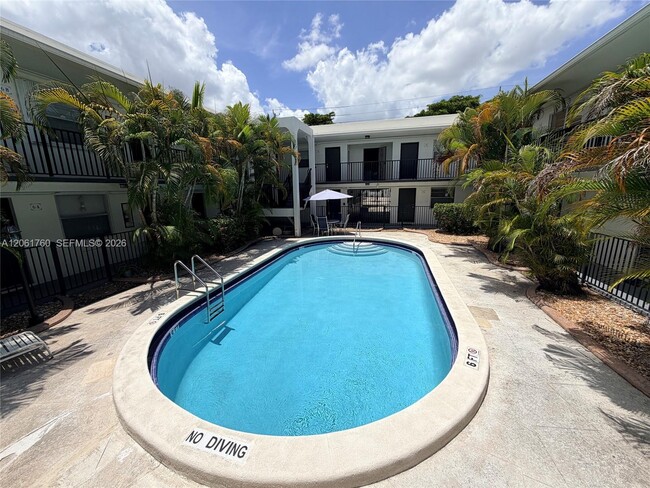 Building Photo - 465 S Royal Poinciana Blvd Unit 9B