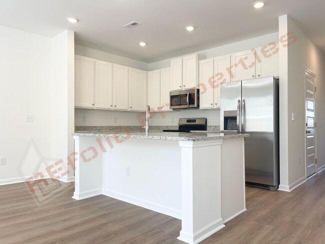 Photo - Move In by April 30 & Save $200/Month! Townhome Only $1,695! Regular $1,950 — Available NOW