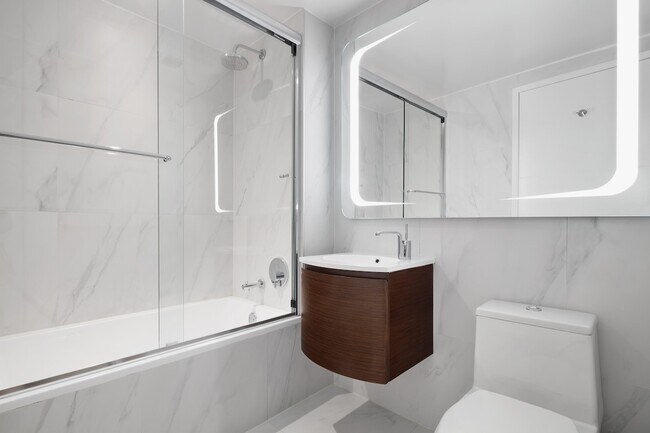 Elevate your lifestyle at The Nathaniel Apartments, where modern design meets comfort. With sleek finishes and spacious layouts, our bathrooms provide a serene retreat. Schedule a tour today and witness the quality for yourself!