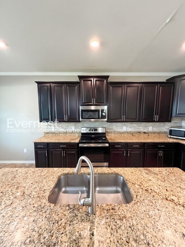 4 Bed & 3 Bath Home with Fenced Yard and Modern Amenities / Voucher Accepted / No Pets Allowed / ...