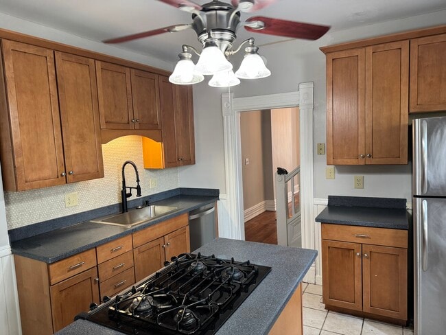 Updated kitchen with new solid surface countertops - 248 W 4th Ave
