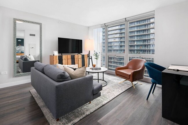 Living rooms filled with natural light at Shoreham and Tides