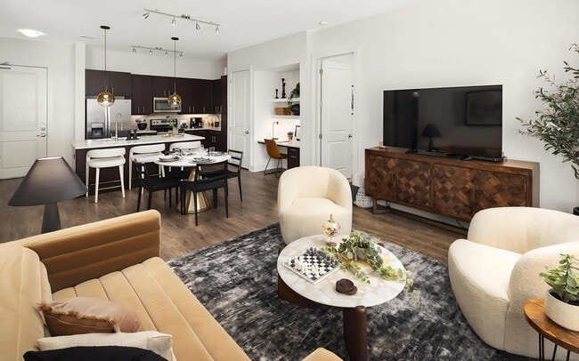 Open Living Room and Kitchen Area With Dining and Workspace Setup