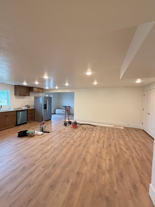View of kitchen, living room, dining room, and entry into unit. - 14 N 300 E