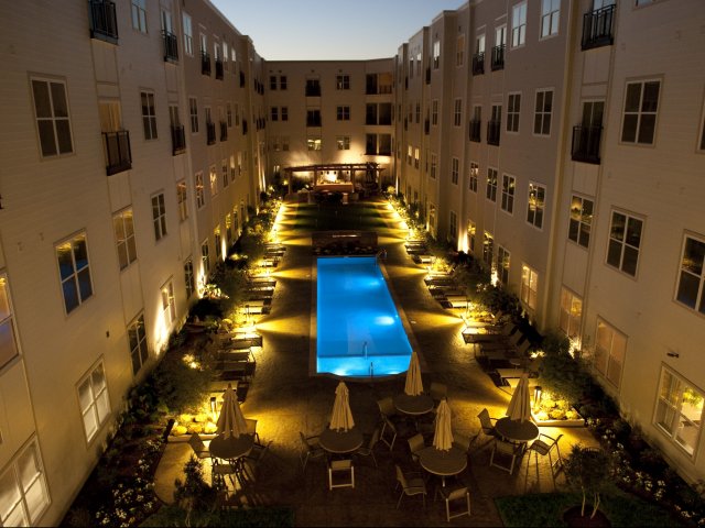 Stunning pool in the courtyard with BBQ grills and firepits.
