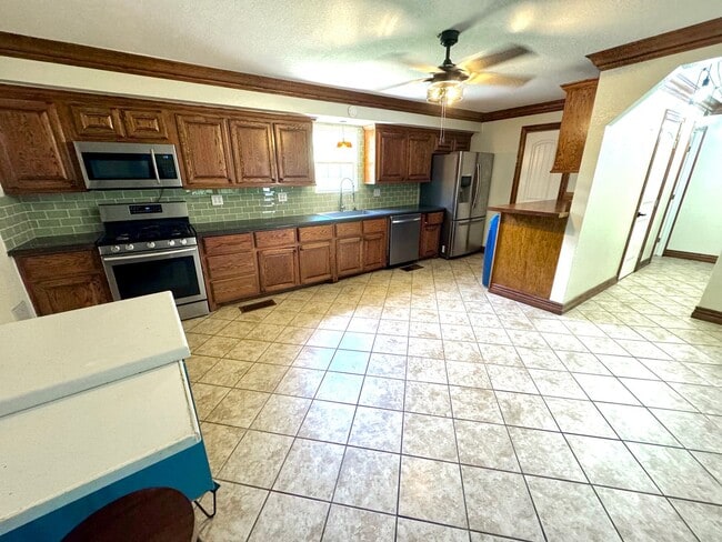 Photo - Charming Bungalow with Large Fenced Backyard, Shed & Great Central Location!