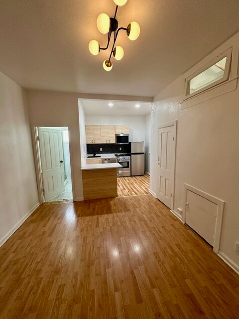 Dining room, fits a 6 top table and 2 bar stools, large storage closet too. Bathroom door to left - 2748 Walnut St Unit A