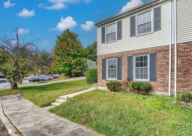 Photo - Updated End-of-Group Townhome with Finished Lower Level, Fenced Yard & Community Pool