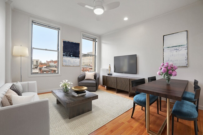 Bright, modern living and dining area featuring stylish furniture and vibrant decor, with large windows offering city views.
