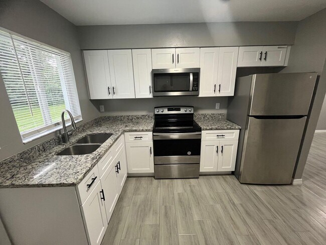 Building Photo - ** COMPLETELY REMODELD UNFURNISHED 2/1 DUP... Rental