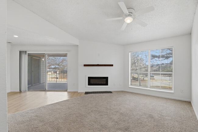 B2 - Two Bedroom Two Bathroom living room with electric fireplace and large patio access.