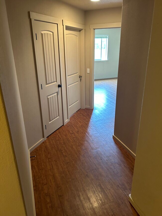 Linen closet next to 3 bedrooms