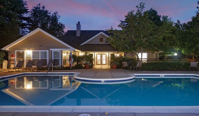 Overlooking the pool and clubhouse at night - Windsor Park Apartments