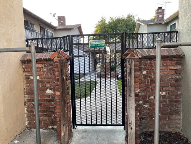 Rear of Gate of Bldg. - 10040 Pomering Rd Unit #E