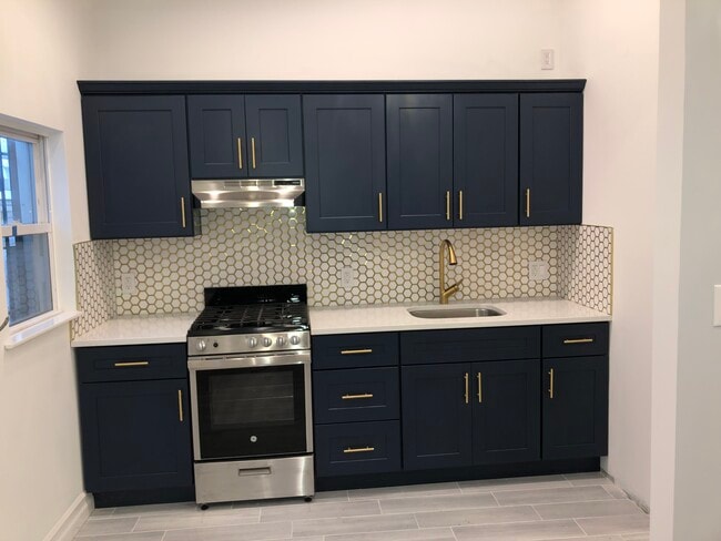 Building Photo - 203 Avenue Z Unit Rear building