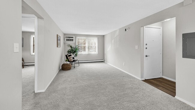 Unwind in your cozy living room with plush carpeting and large windows, your haven for relaxation.