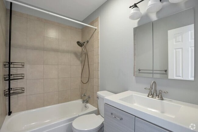 Building Photo - Inviting Townhome w/ 2-car Carport off the...