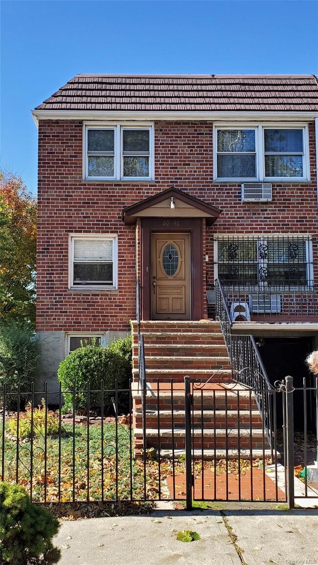 Building Photo - 60-46 69th Pl Unit #1