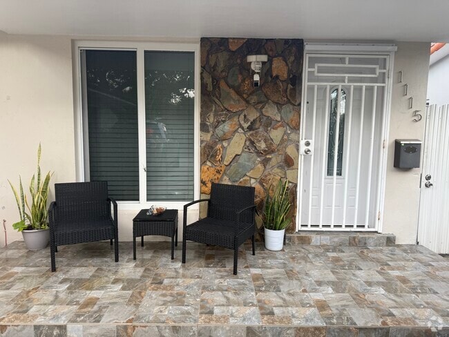 Front part of the house with a private gated entrance to backyard - 1115 NW 32nd Ave Rental