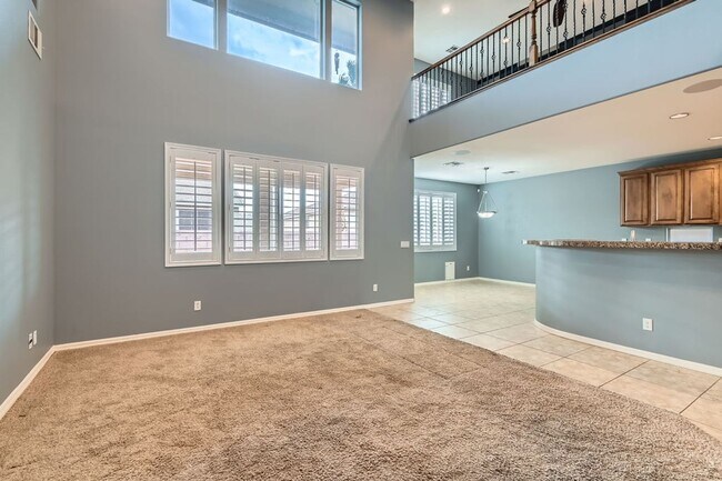 Photo - Gorgeous 5 bd, 3 1/2 bath, 3 car in gated community with strip and mountain views!
