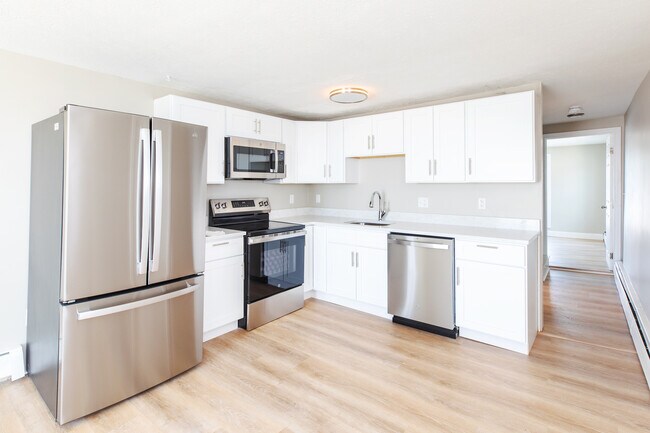 Fully updated kitchen with modern cabinets and appliances. - 487 Ocean Blvd Unit 3