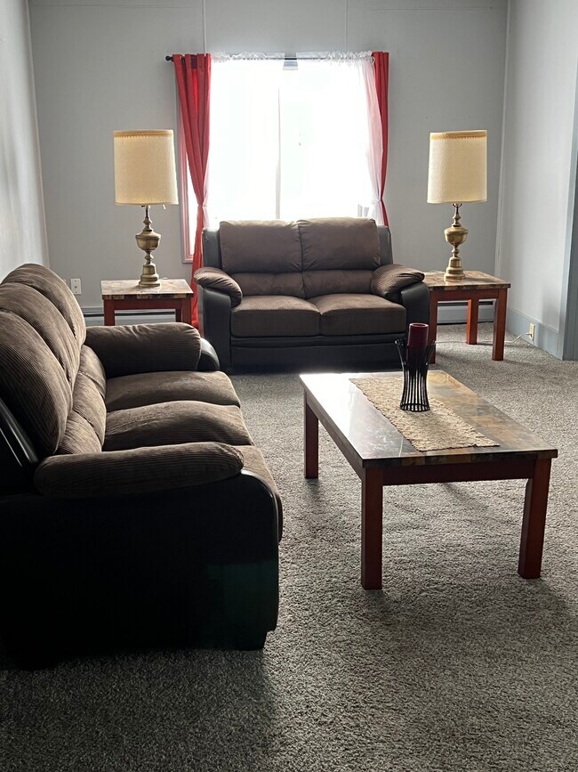 Includes couch, loveseat, chair, end tables, coffee table and lighting