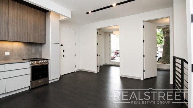 Photo - Brand-New 2-Bedroom Duplex with Private Basement & Premium Amenities Unit 1B