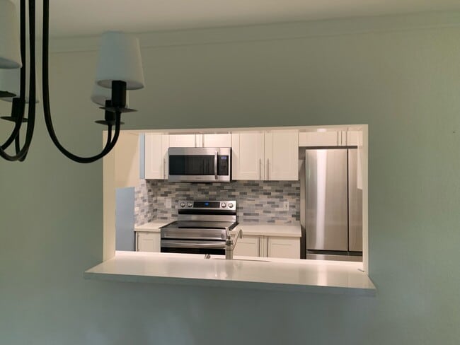 View from dining room to the kitchen - 220 NE Dogwood St Unidad B102