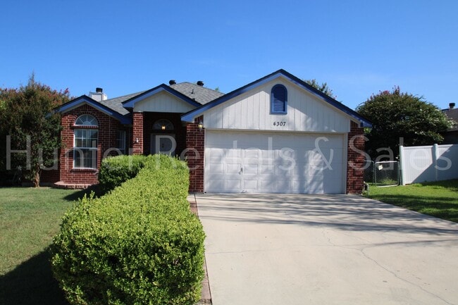 Building Photo - Exceptional Living with Vaulted Ceilings, Cozy Fireplace & Expansive Outdoor Space