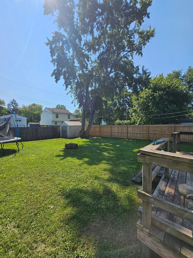 Privacy Fenced in back yard. Shed and trampoline will stay.