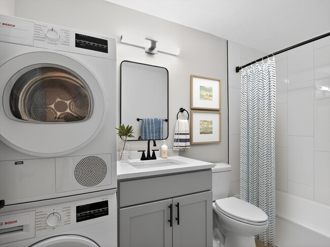 Elevate your lifestyle at Eagle Rock Apartments at West Hartford. This stylish bathroom features modern amenities, including in-unit laundry and sleek finishes for ultimate convenience. Don’t miss out—schedule your tour today!