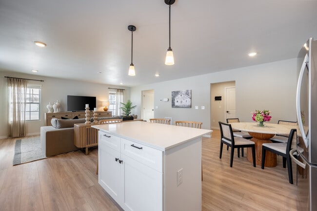This modern kitchen pairs sleek finishes with plenty of space to cook, sip, and gather. - Liv East Bay