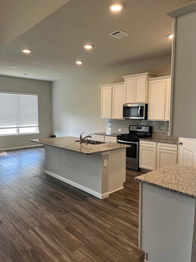 Photo - Four bedroom home with dedicated home office, game room, 2.5 bathrooms, and fenced yard in Fairwa...