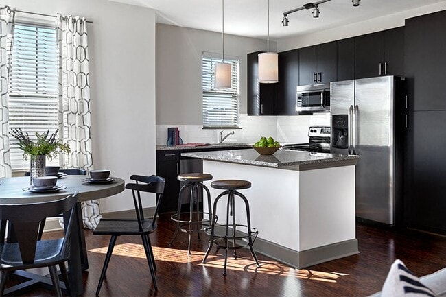Chef inspired gourmet kitchens with Stainless Steel appliances and side-by-side refrigerator