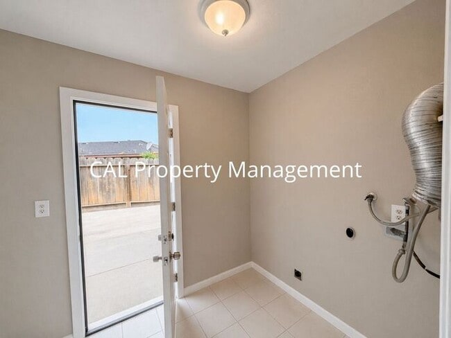 Photo - Spacious 4-Bedroom Home with 2-Car Garage & Backyard Oasis