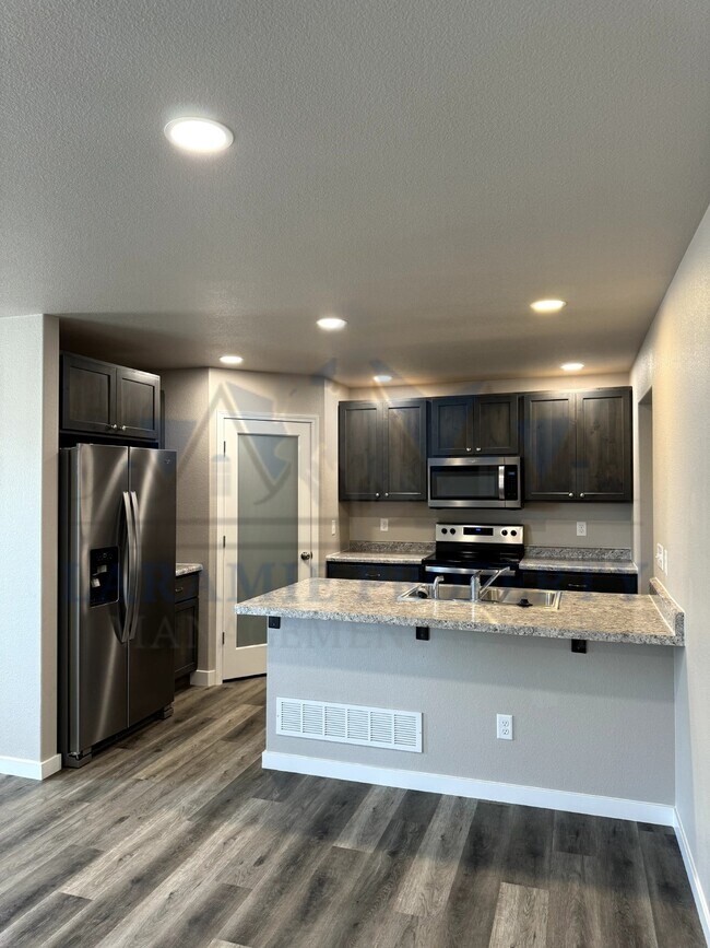 Photo - 4-Bedroom, 4.5 bath Condo - 1/2 OFF 1ST MO... Unit 206A