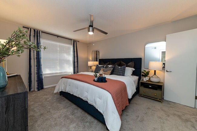 Cozy bedroom with carpet & overhead lighting