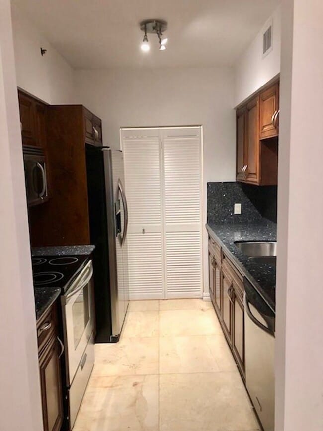 Photo - Spacious 1-bed, 1-bath condo is nestled in the gated waterfront community of The Yacht Club at Av...