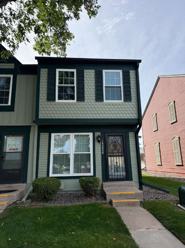 Building Photo - Cozy 2 Bed, 1.5 Bath Townhouse with Fireplace + Community Pool + Reserved Parking Space! Unit A