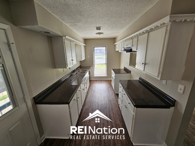 Photo - Move-In Ready 3BR Gem in Memphis - Cozy Fireplace, Tile Dining & Private Yard