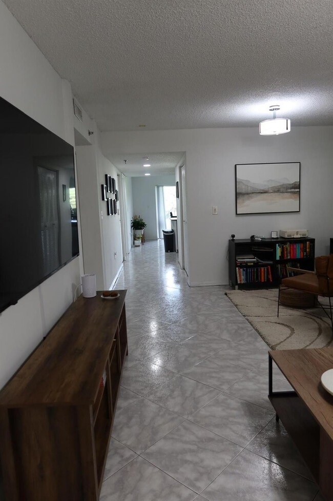 Building Photo - 9470 Tangerine Pl Unit 208