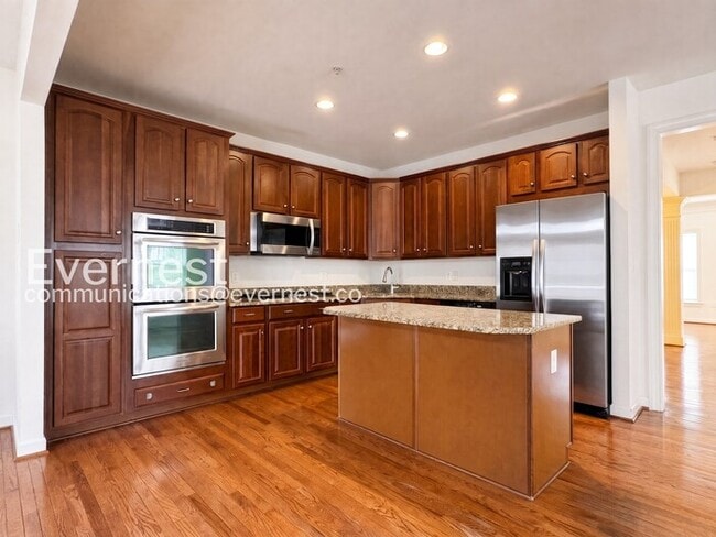 Photo - Spacious Living with Fireplace, Deck & Garage / 3 Bed & 4 Bath / Available Now!