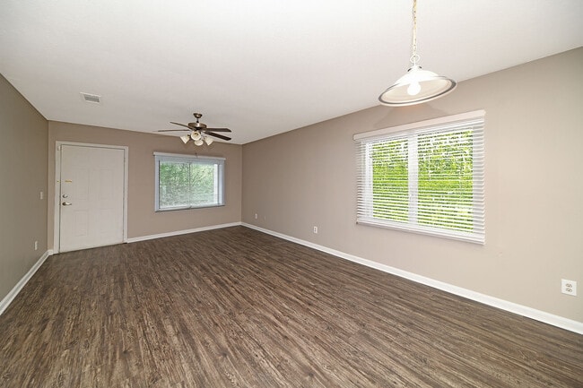 Spacious living room with hardwood-style flooring