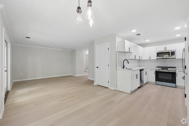 2BR, 2.5BA - 1,388SF - Kitchen and Living Room