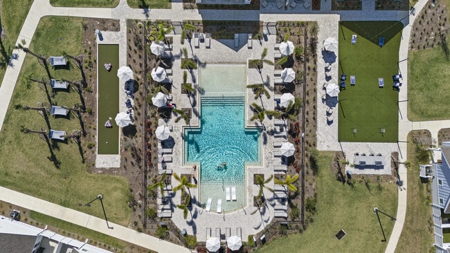Experience luxury living with this breathtaking outdoor pool area, perfect for relaxation and leisure.