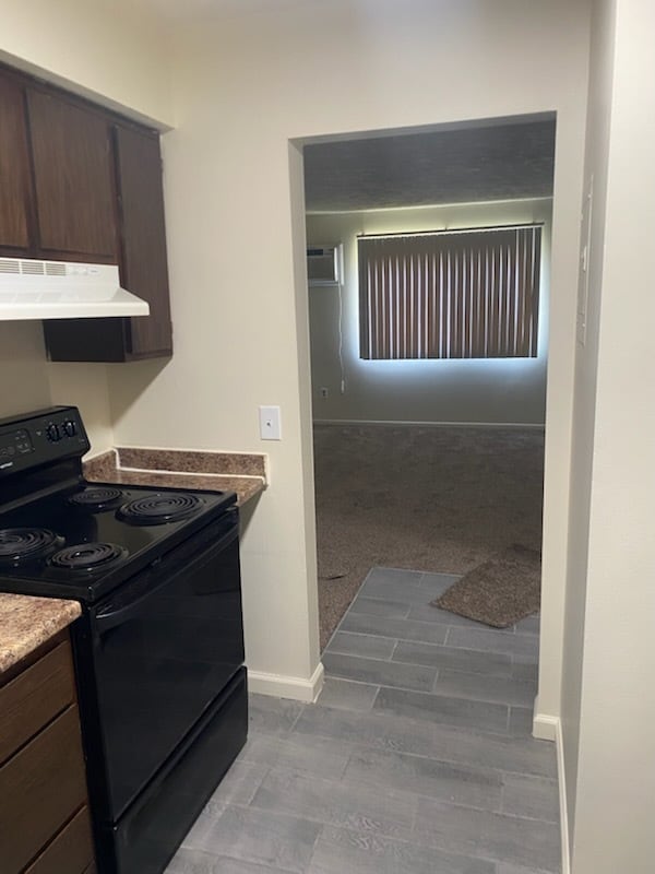 Kitchen looking into Living Room - Oak Forest Apartments